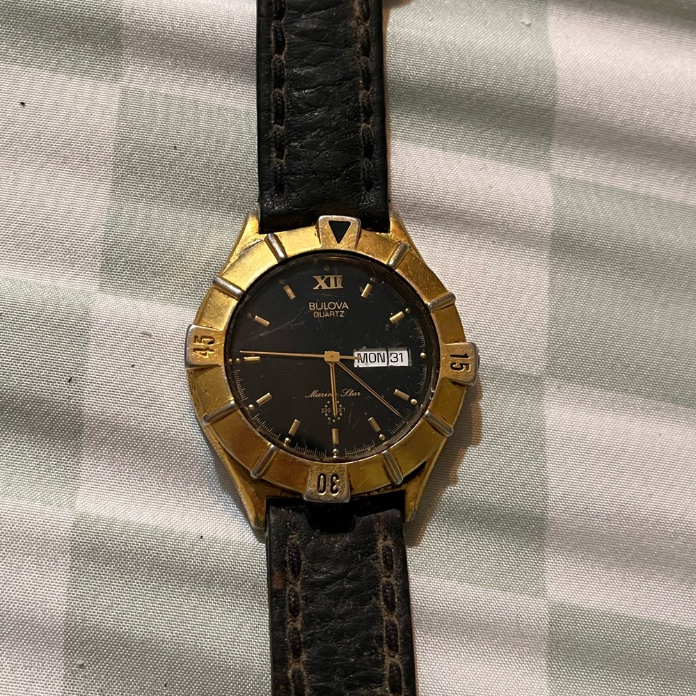 Bulova Black and Gold Luxury Watch Elegant Design